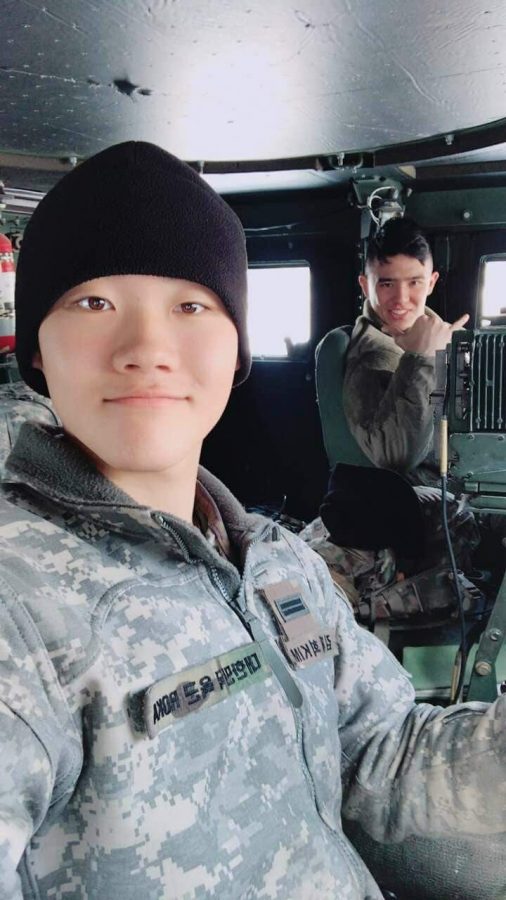 Joe Kuntz is pictured with a South Korean soldier inside a humvee; the weather is similar to Wyoming in Seoul, South Korea.