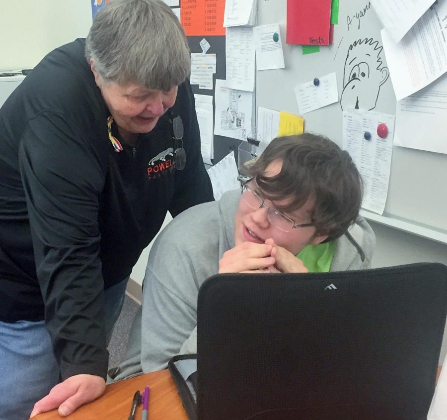 Mrs. Bonita Rouse helps senior Ian Ley with an assignment.