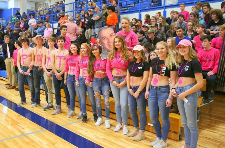 Powell High school seniors pose in front of the Powell student section with “Panthers” painted on their stomachs to show support for the boys’ basketball team during their match up against Cody on Friday, Jan. 26.
