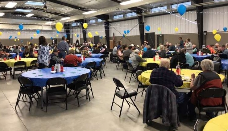 Community members enjoy the steak dinner at the fairgrounds on March 17.