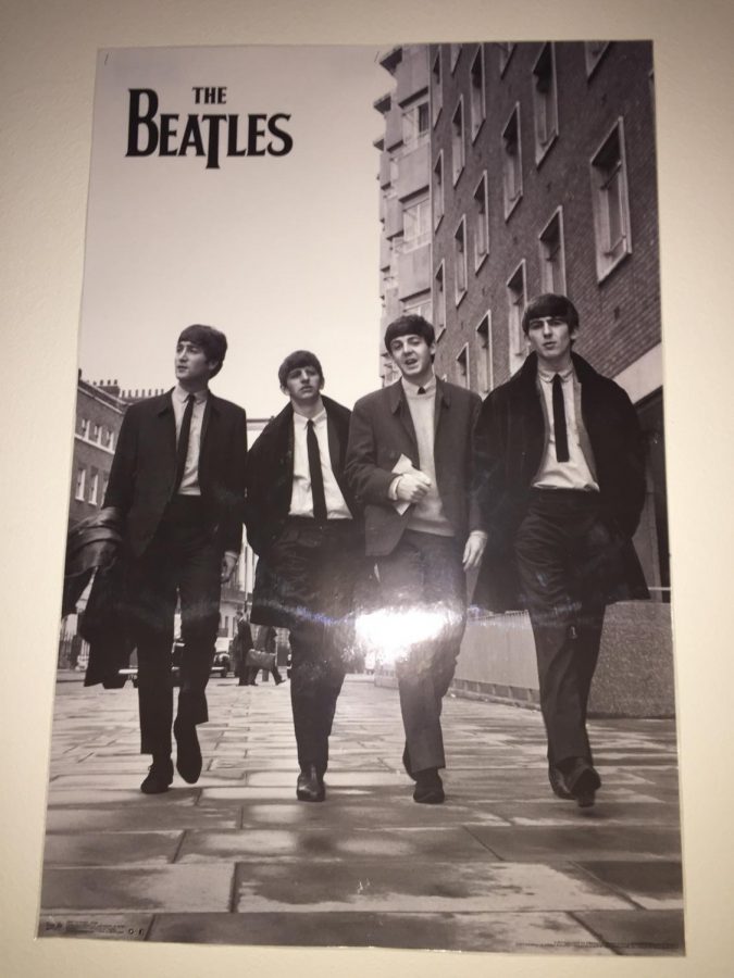 A poster  of The Beatles, one of the original psychedelic rock bands, hangs in Mr.Cappiellos room. 