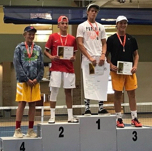 PHS junior Dylan Preator stands atop the podium after winning the state title at No. 2 singles.