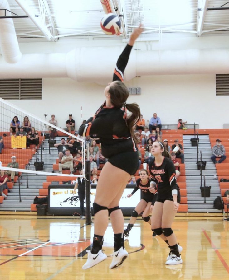 Senior right side hitter Rachel Bonander goes up for a kill against Worland at the Lady Panthers home game on Sept.15
