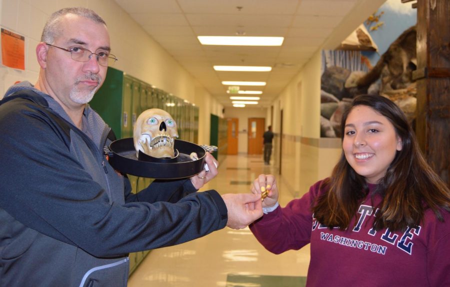 Prowl adviser Mr. Vin Cappiello (left) and social media editor Scarlette Mendoza disagree about what Halloween means.