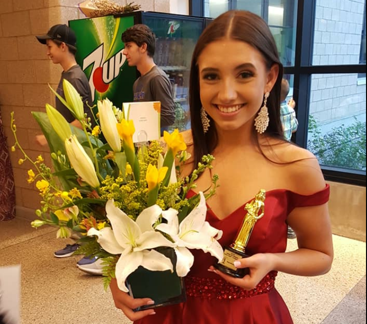  Junior Lauren Lejeune’s holding a bouquet of flowers she received after the  Miss Wyoming Teen USA pageant was over. 