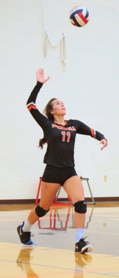 Jazlyn Haney serves during the senior night game on October 18th.