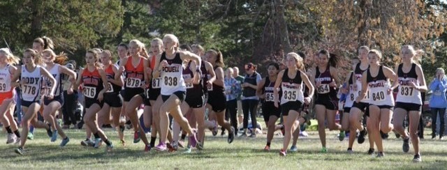 The PHS girls cross country team takes off from the start line at the state competition in Sheridan.