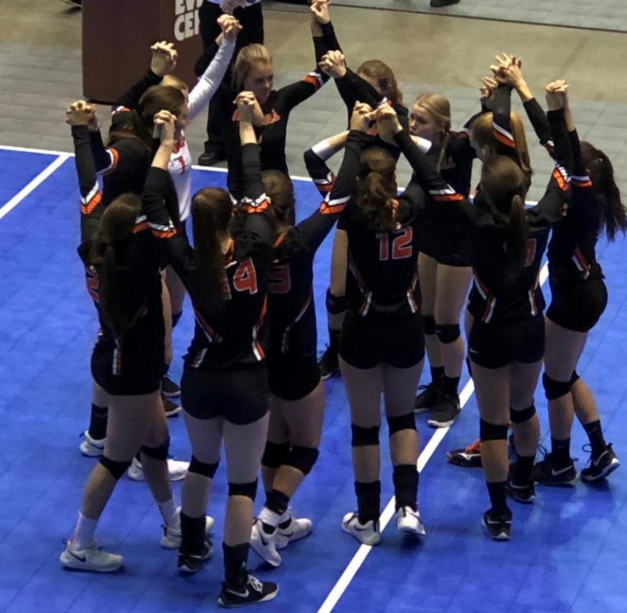 The+Lady+Panther+volleyball+team+stands+in+their+traditional+team+huddle+before+taking+on+the+Douglas+Lady+Bearcats+in+the+first+round+of+games+at+the+state+tournament+at+the+Casper+Events+Center.