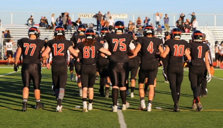 Senior Panther football players walk onto the field for the coin toss before their final game on Oct. 19.