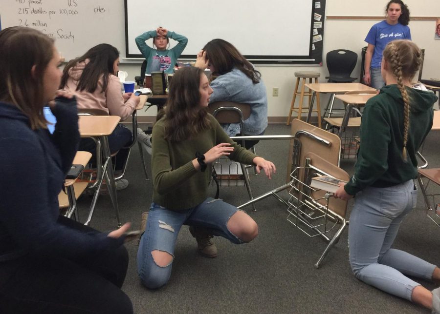 Prowl editor Rachel Kuntz looks away in frustration as reporters look at their phones or fail to pay attention during a news meeting.