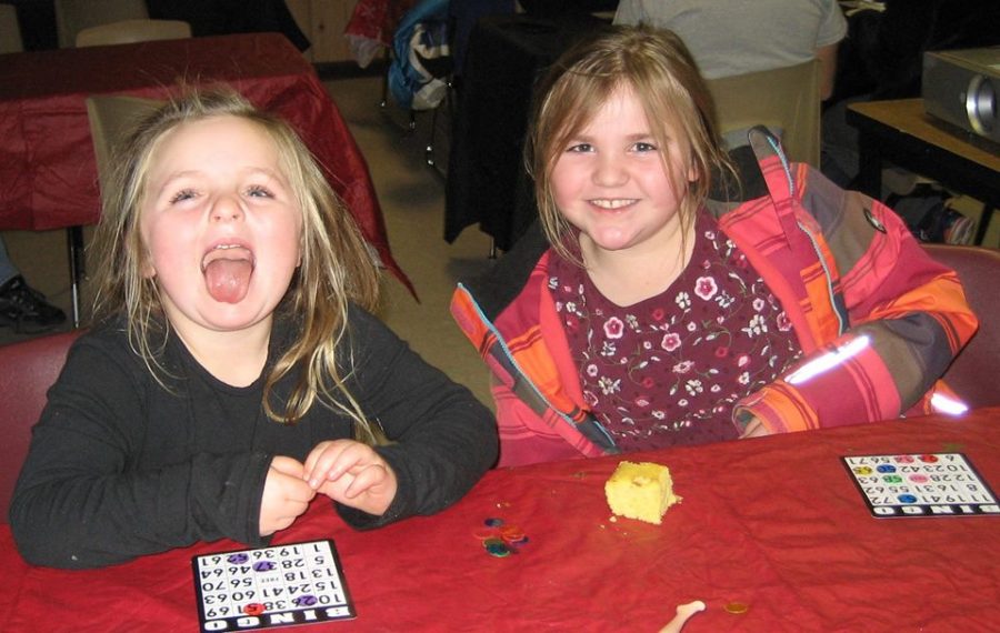 Two “Littles” playing bingo at one of the Family Match activities.
