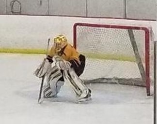 Eighth-grader Jack Beaudry prepares to make a save against the Casper Oilers.