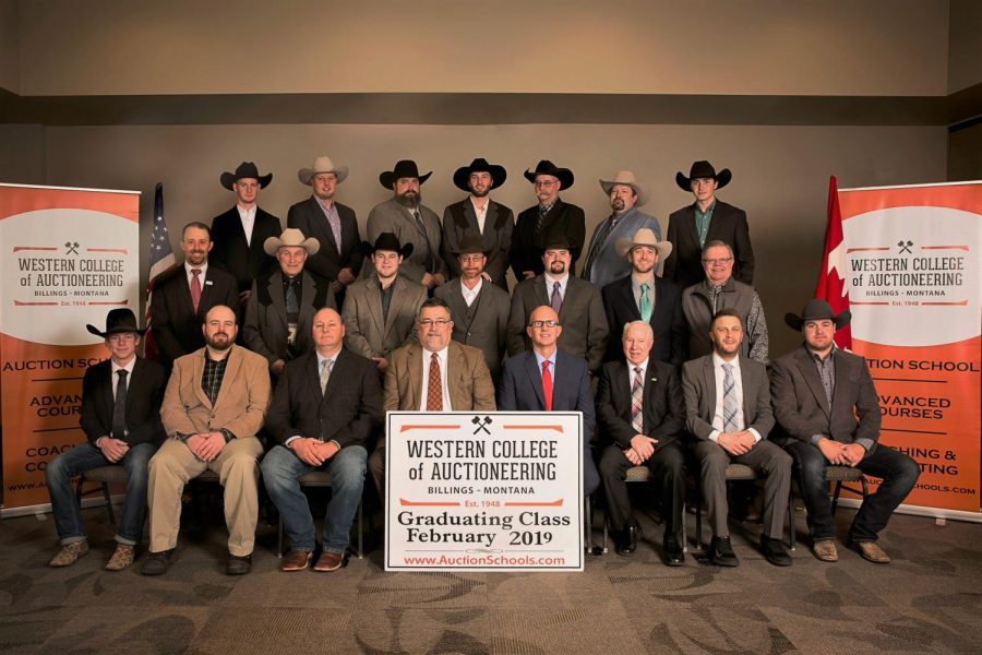 Colter Klemm sits with the Western College of Auctioneering graduating class of 2019