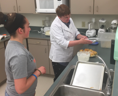 PHS sophomore Maggie Cappiello (left) works with culinary arts instructor Mrs. Denise Laursen to prepare for the 2018 state SkillsUSA competition.
