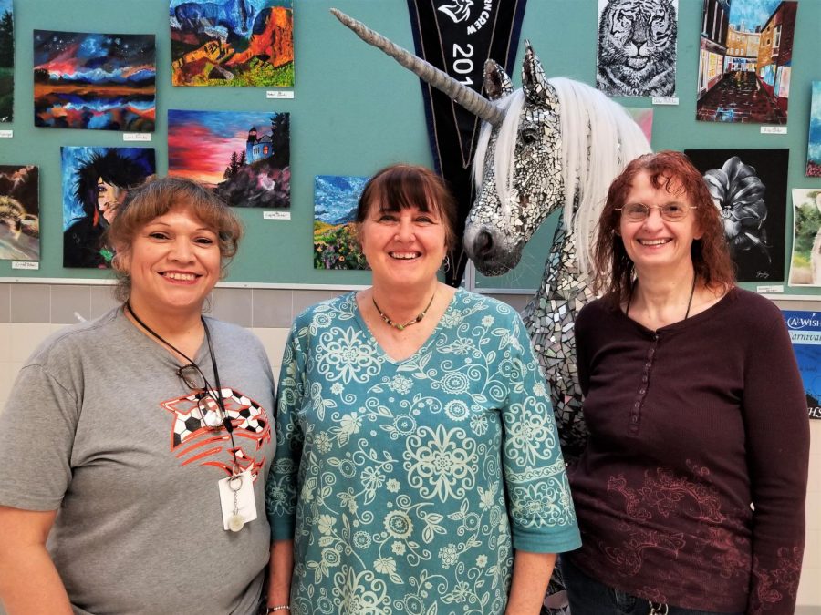 (From left) Delia Carbajal, Linda Tilley, and Jan Castro pose for a picture. They serve as Powell High Schools evening custodial staff. 