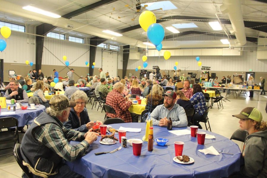 FFA Dinner Dance goers converse and eat at the Park County Fairgrounds.