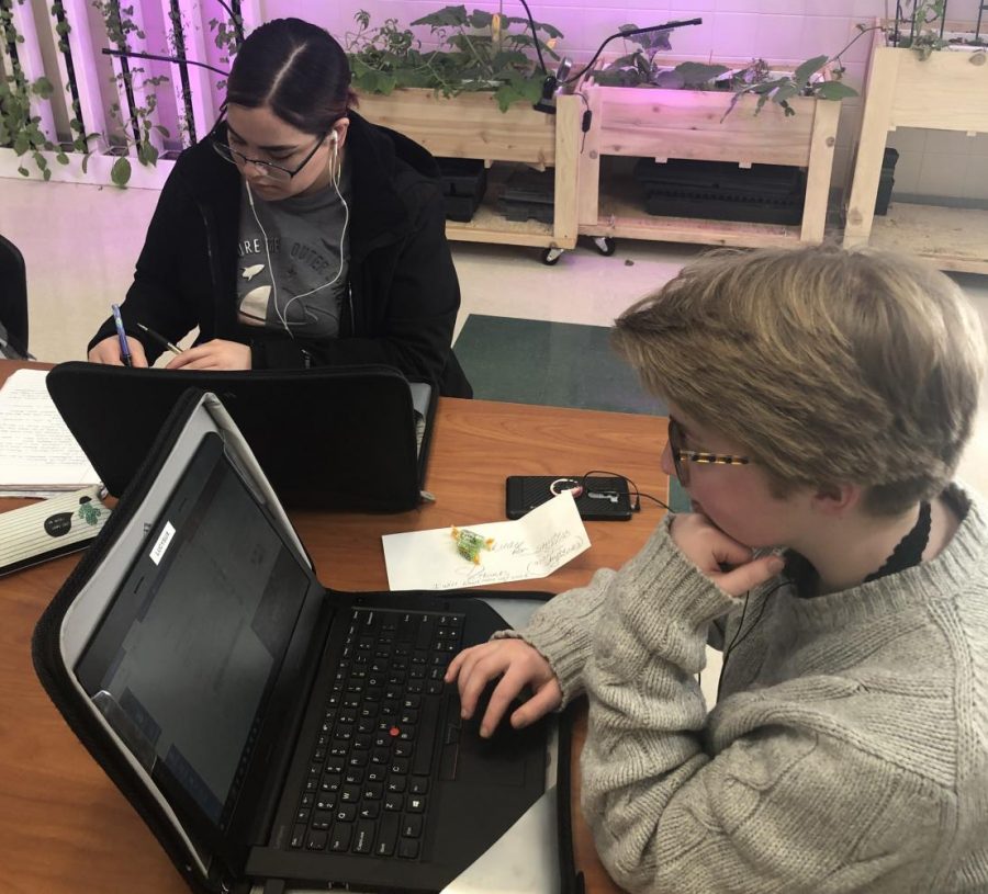 Ariana Rodriguez (left) and Lucy Sullivan work diligently on their college classes. April 22-26 is PHS spring break which gives students a chance to catch up on college classes.