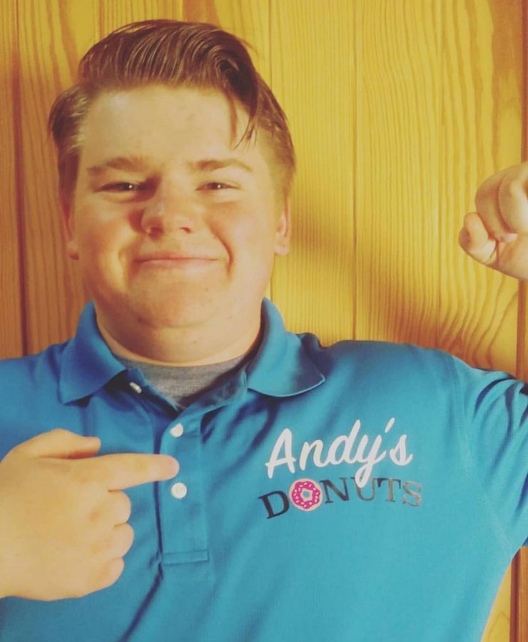 Andy Beavers shows off the Andys Donuts logo.