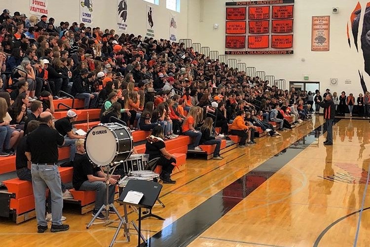 Principal Mr. Jim Kuhn addresses students during the 2018 Homecoming assembly, one of many popular high school events.