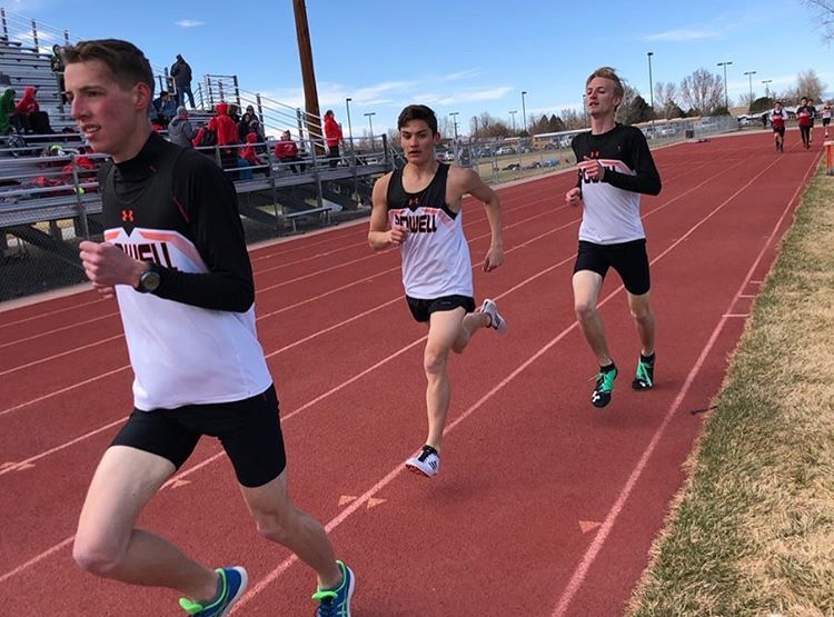 Alan Merritt, Tyler Pfeifer,and Jayden Yates run the mile race at a Worland track meet last spring. Outdoor fitness it one way to keep the mind and body sharp during this non-traditional learning time. 
