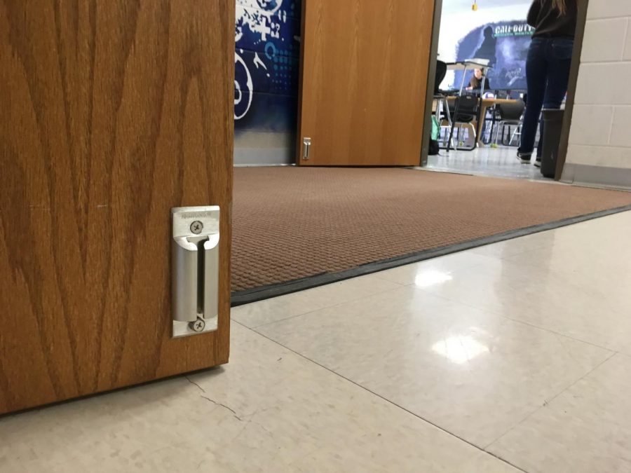 Mr. Vin Cappiello’s classroom door, along with all of the doors at the Powell High School, now have a door stopper, a new lockdown feature.
