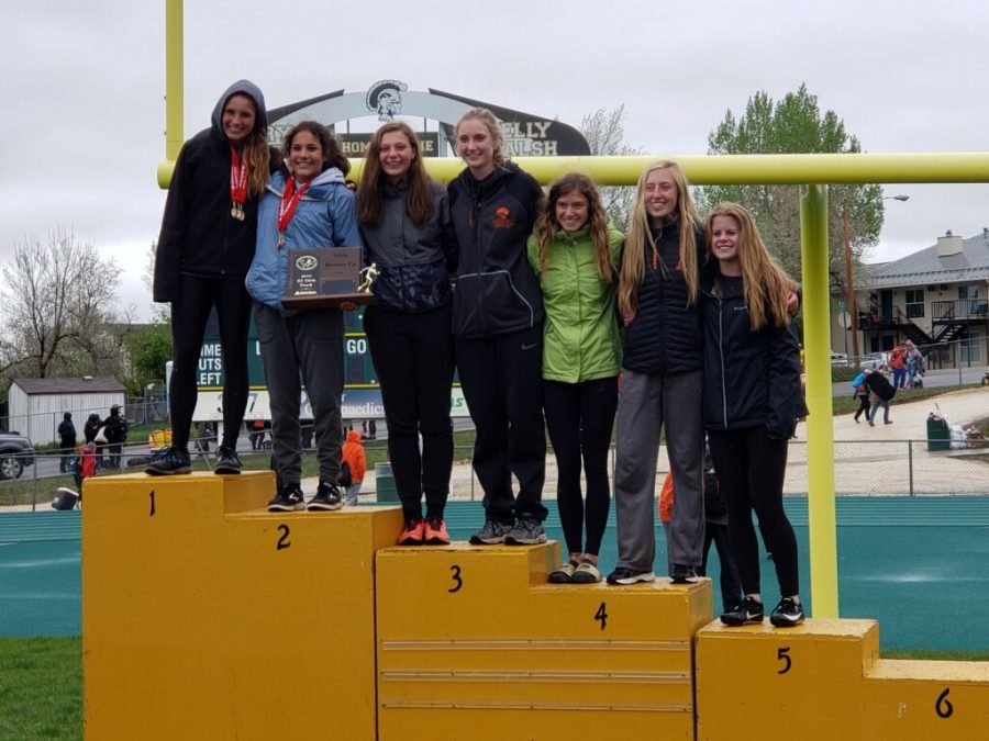 Members of the Powell Lady Panther Track and Field team pose on the podium after the state meet in Casper. (From left: Sabrina Shoopman, Emma Karhu, Sidney O’Brien, Hailee Hyde, Hailee Paul, Abigail Urbach and Jenna Hillman.)