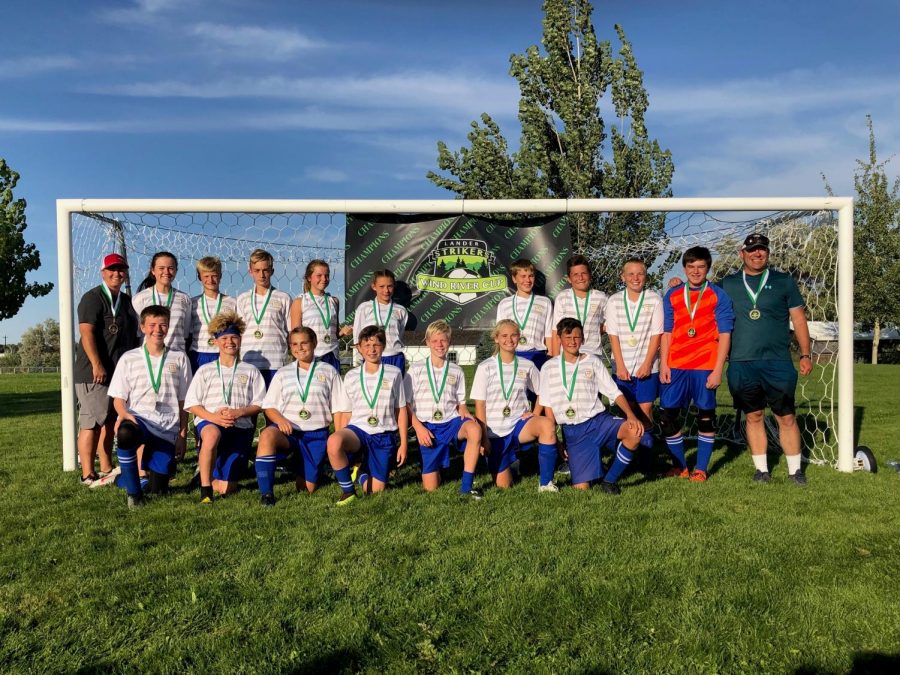 The U16 Heart Mountain Soccer team pose for a picture with their medals after winning a soccer tournament in Lander. 

