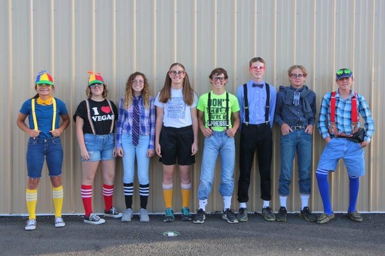 PHS Freshman (Left to Right) Abigial Wambeke, Jordyn Schuler, Alexis Terry, Megan Jacobsen, Simon Shoopman, Jace Hyde, Jack Beaudry, and Steven Stambaugh mockingly imitate nerds for the Homecoming Olympics.