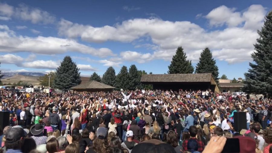 Fans gather to sing worship music with Kanye West.