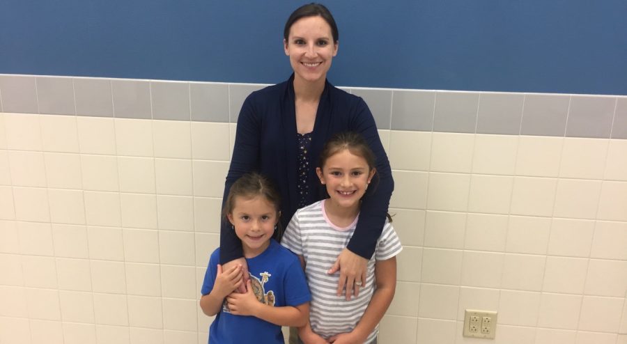 Kallie Papich stands with her two daughters (from left) Anna and Emma.