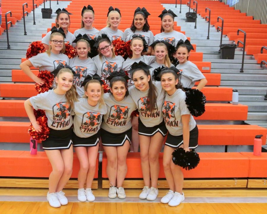 The Powell High School cheerleaders cheer on the Lady Panthers volleyball team during their game against the Thermopolis Bobcats on Sep. 12.