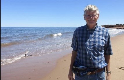 Mr. Doug Ramier, a Powell High School substitute teacher, stands on the shore of Prince Edward Island in Canada. 
