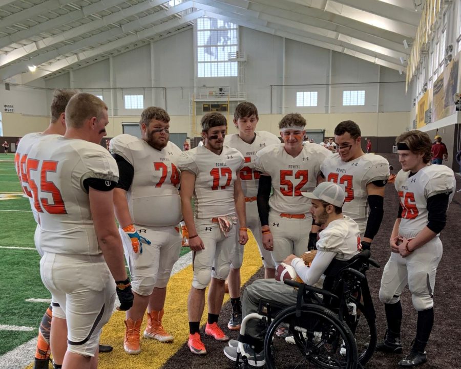 The+PHS+football+seniors+gather+around+injured+teammate+Ethan+Asher+after+being+reunited+with+him+for+the+first+time+since+Ashers+accident.