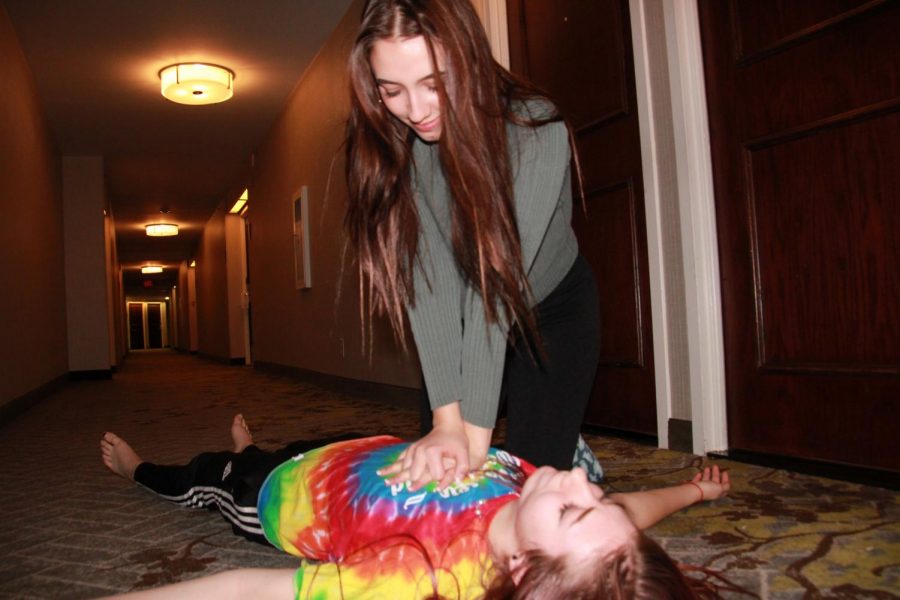 Senior Lauren Lejeune demonstrates proper CPR technique on fellow senior and Prowl member Lauren DeWitz.