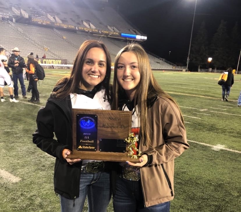 Sophomore Panther football managers, (from left) Brooklynn Bennett and Madison Harvey hold State Runner-Up plaque at the 2019 3A Football State Tournament held in Laramie, on Nov. 16. 