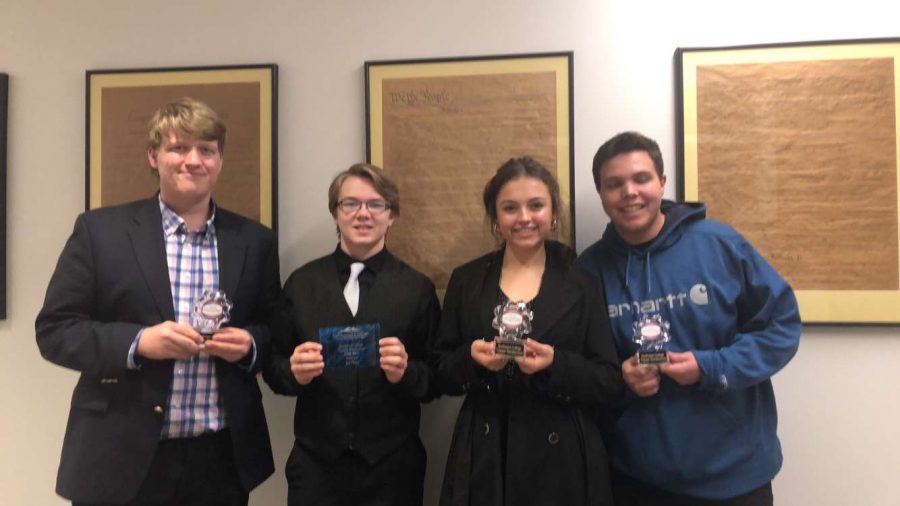 Members of the Powell High School Speech and Debate team present their awards won at the Northwest College Speech and Debate Tournament. (From left) Duncan Bond, Aiden Chandler, Elise Spomer and Jaxton Braten.