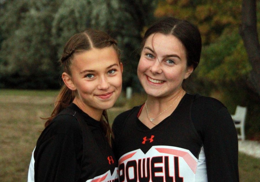 Senior foreign exchange students Greta Artursson and Sanne Flateby pose for a picture at a cross country meet last fall.