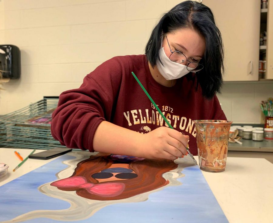 PHS senior Dylan Croft works on her painting during art class. Croft moved from Gillette to Powell this year.