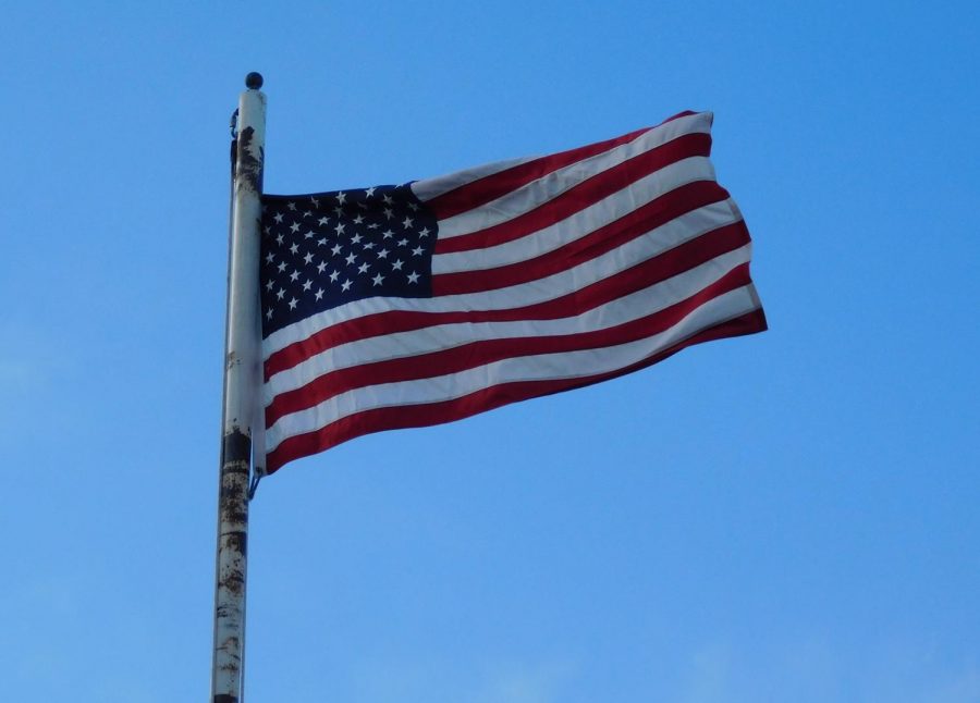 The American flag has 13 stripes to represent the original 13 colonies and 50 stars to represent the 50 states. The red used is to symbolize valor, white to symbolize purity, and blue to symbolize perseverance and justice. 