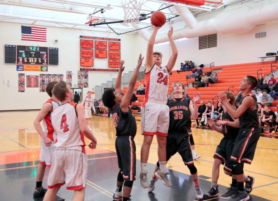 PHS senior Ashton Brewer rises for a layup during a basketball game against Worland. Brewer played on the junior varsity team during the 2019 basketball season. 