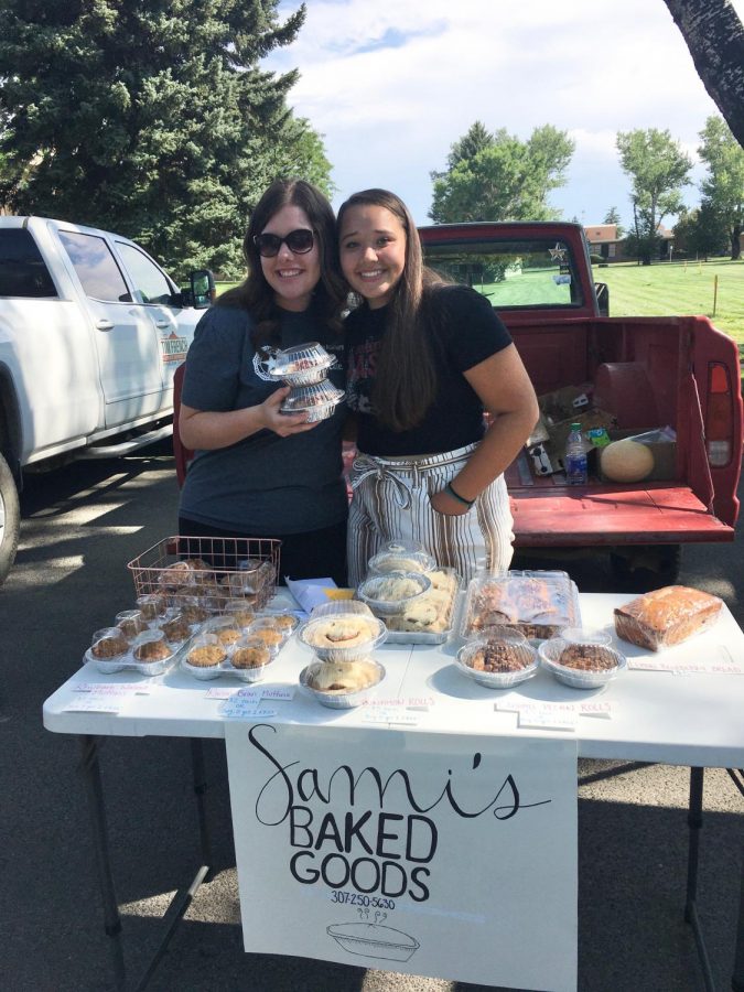 Senior Sami Cole selling her baked goods at the farmers market this summer.