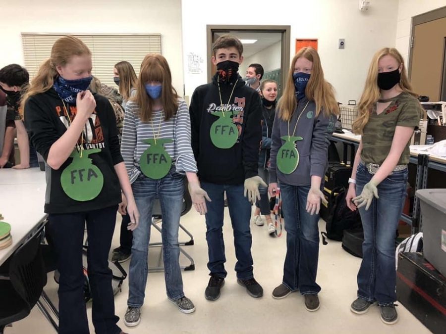 Freshman FFA members show off their green hands after participating in the Green Hand Ceremony which took place Wednesday morning, Feb. 24. 