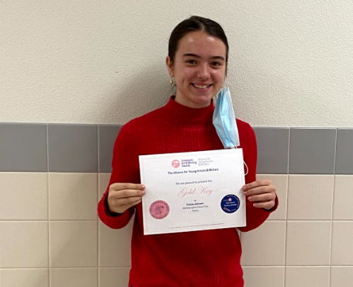 Emma Johnson shows her Gold Key Award presented to her after her poem, “Wishing Upon a Dead Star” advanced to the national level for the Scholastic Art and Writing Awards. 