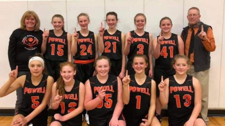 Coach Dale Estes (back right) poses with fellows Coach Tracy McArthur and the Powell Middle School eighth-grade girls basketball team last December.