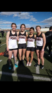 Megan Jacobson(far left), Anna Bartholomew (left center), Abigail Wambeke(right center), and Jenna Hillman (far right) get ready for their first relay of the track season.