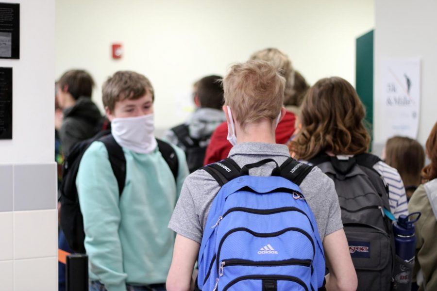 Powell High School students walk to class shortly after Principal Mr. Timothy Wormald announced that students will no longer have to abide by the previous mandated hallway traffic patterns. 