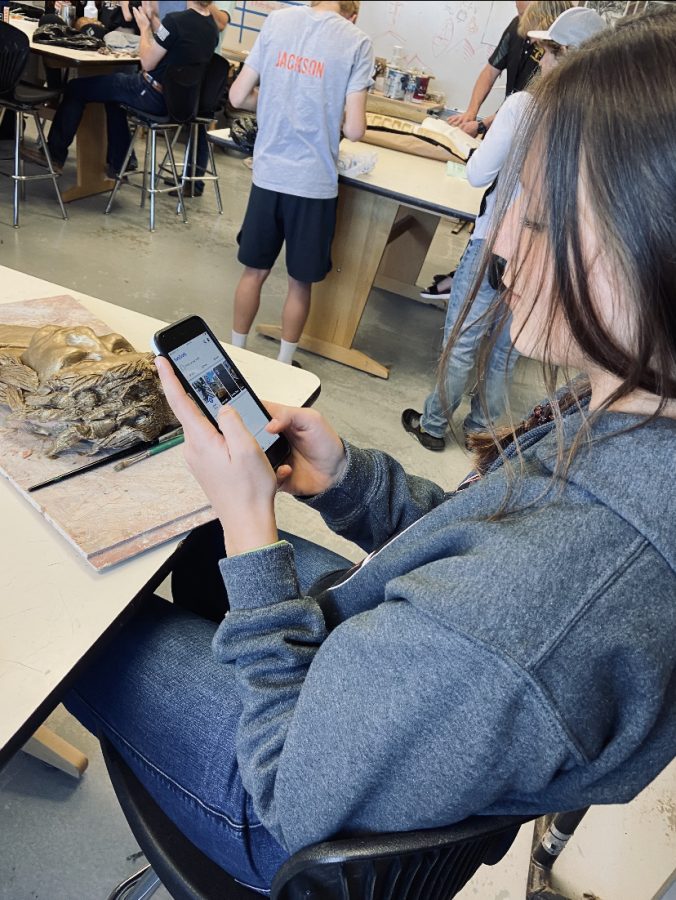 PHS+sophomore+Jordyn+Deercorn+demonstrates+being+on+her+cellphone+during+class.