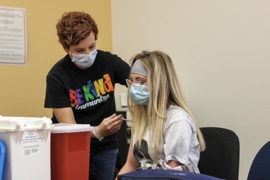 Park County Public Health nurse gives sophomore Emma Short Pfizer’s COVID-19 vaccine at the vaccine clinic held at the high school on April 28. 