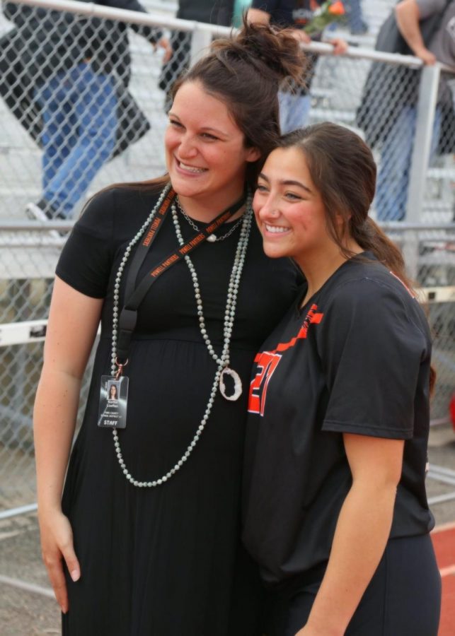 (From left) Mrs. Kailtin Loeffen and senior Payton Asher are all smiles on senior night, May 1. 