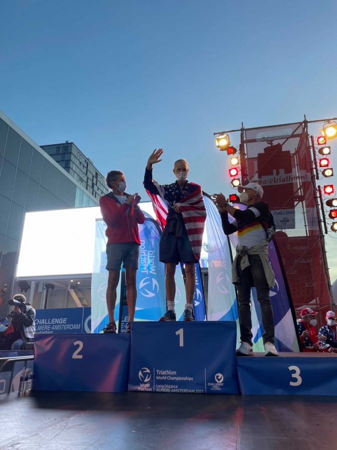 PHS Girls Swimming coach, Bob Smartt, stands on the podium after winning his age group of 65-69 year old men at the World AquaBike Championship on September 12.